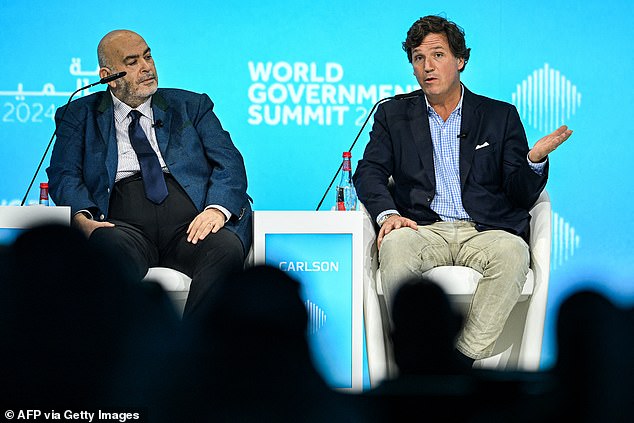 Egyptian journalist Emad El Din Adeeb (left) interviews Mr Carlson at the World Government Summit in Dubai on Monday, February 12