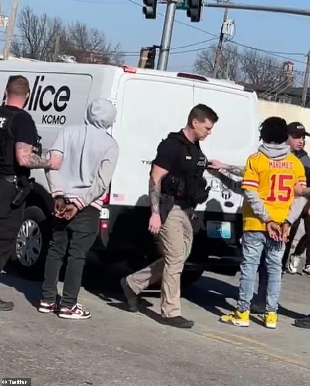 Two unnamed juveniles have been charged with crimes related to the mass shooting at the Kansas City Chiefs' Super Bowl rally.  It is not clear if these were the young men detained in the photo above, taken after the shooting