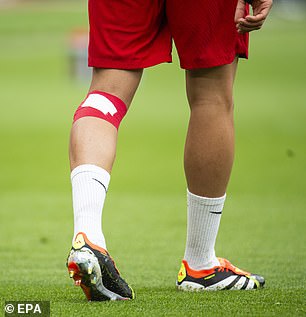 Ahead of their win against Burnley, the England full-back was seen warming up with a bandage on his left knee