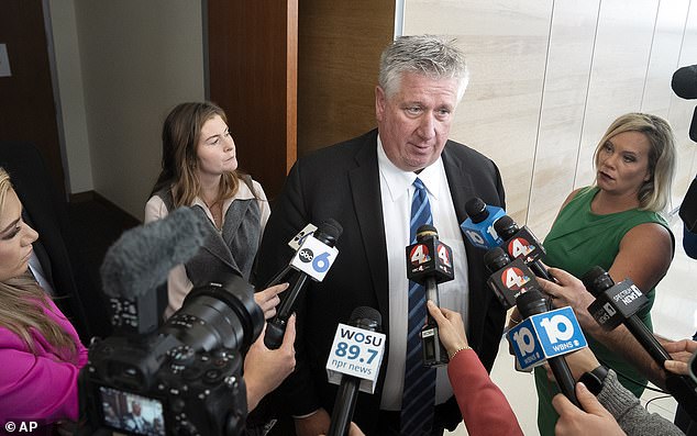 Attorney Mark Collins speaks to reporters as co-counsel Kaitlyn Stephens stands nearby