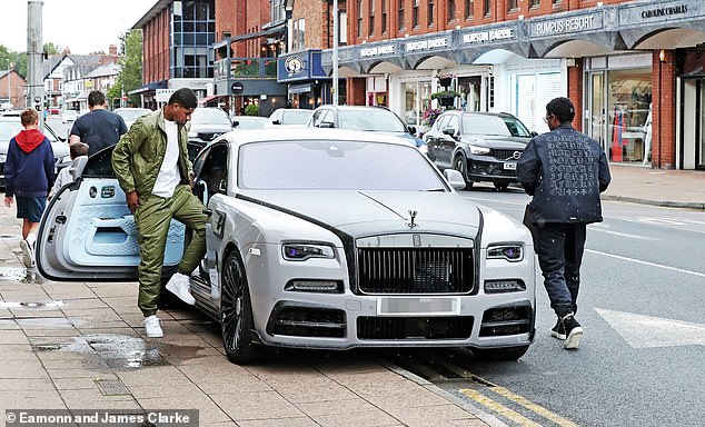 Rashford (left) was previously seen getting into a £700,000 car at a jewelers in Cheshire