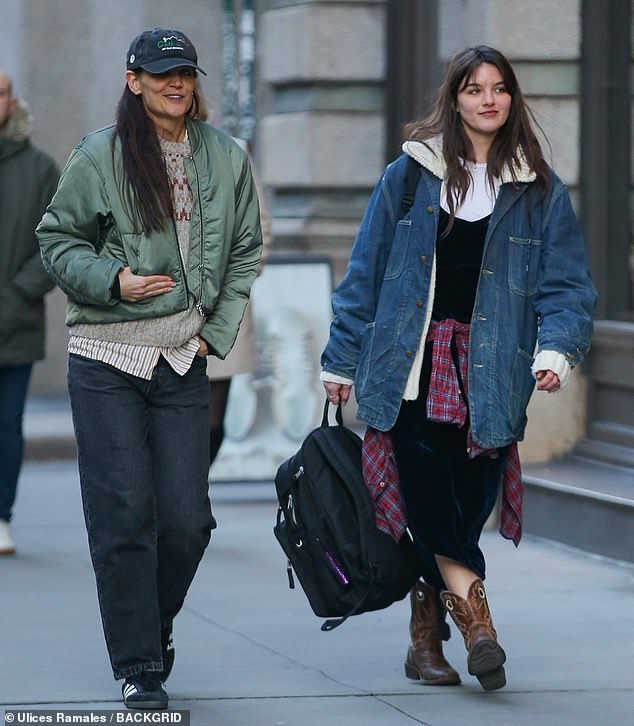 The Dawson's Creek actress wore loose-fitting dark jeans and a striped button-up sweater with a gray pattern to help her stay warm in cooler temperatures