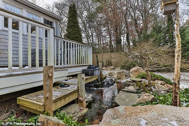 The home's backyard features two goldfish ponds, a patio and a gazebo in a private setting