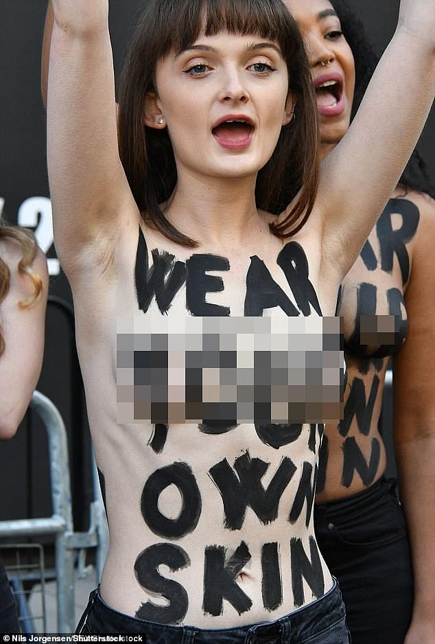 Topless vegan protesters storm London Fashion Week in angry flash mob organized by PETA in 2018