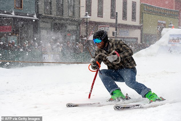 Skier Greg Dahl makes a turn after collecting a series of rings during the 74th annual Leadville Ski Joring weekend competition on March 6, 2022 in Leadville, Colorado