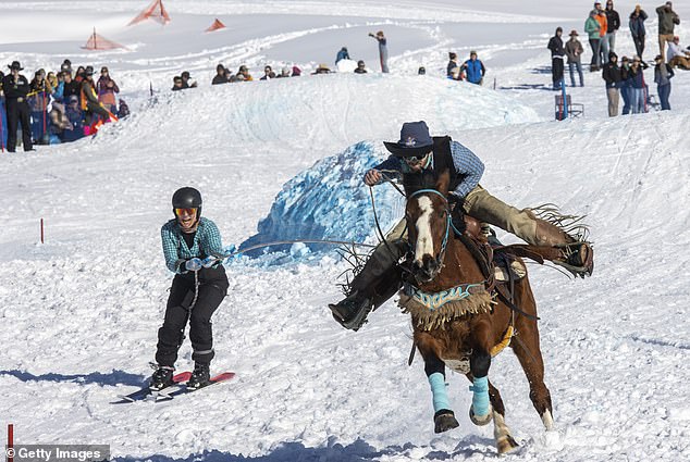 Skier Kate Serpe is pulled by rider Braiden Klinger during a Skijoring competition on February 25, 2023 in Driggs, Idaho