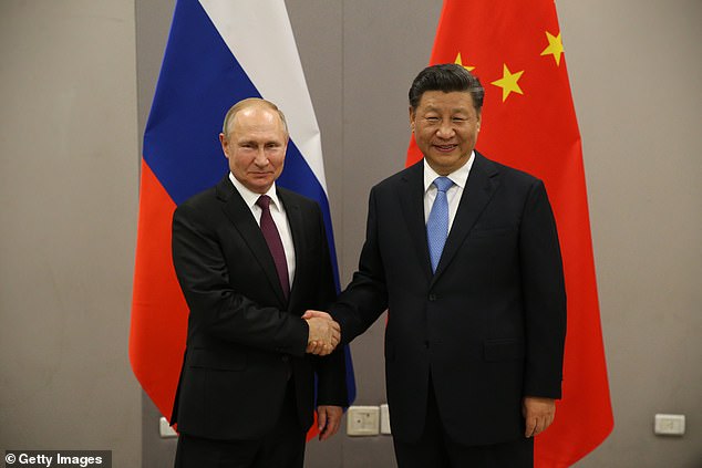 Russian President Vladimir Putin (L) meets with Chinese President Xi Jinping (R) in 2019. US adversaries are forging closer ties and cooperation, a former Trump adviser warns