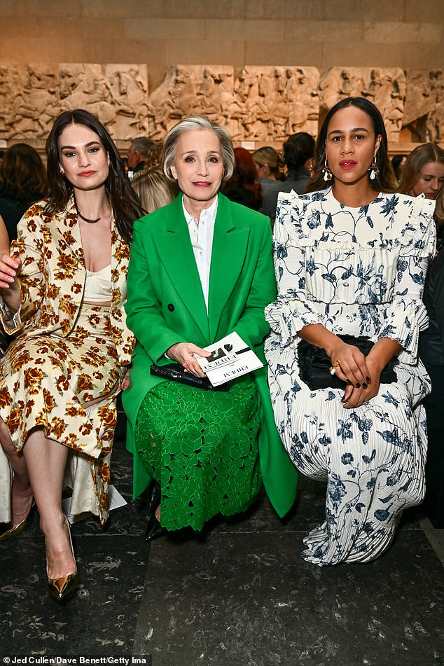 She beamed on the catwalk as she sat next to Dame Kristin Scott Thomas and Zawe Ashton (L-R).