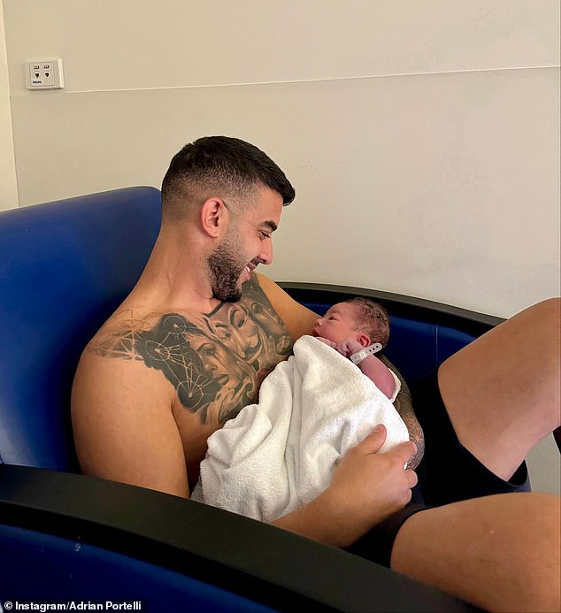 One adorable photo showed a shirtless and smiling Adriaan in a chair gently rocking the baby, and another photo showed him gazing lovingly at his child