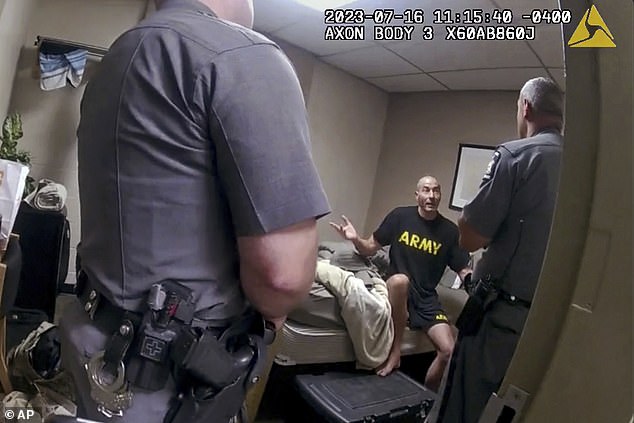 The footage provides a chilling glimpse of Card after he was involved in an altercation and locked himself in his motel room, alerting reservists.