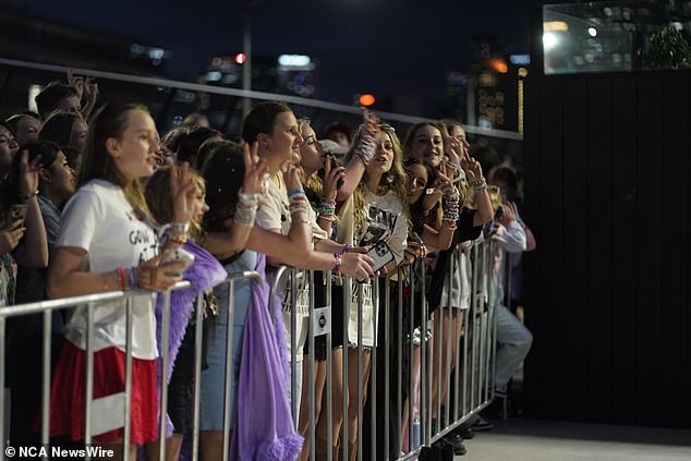 Melbourne returned the love by giving Swift a one-minute ovation.  In the photo: fans at night