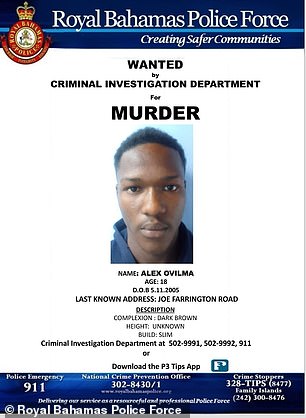 Wanted posters are seen for murder suspects wanted by Bahamian police