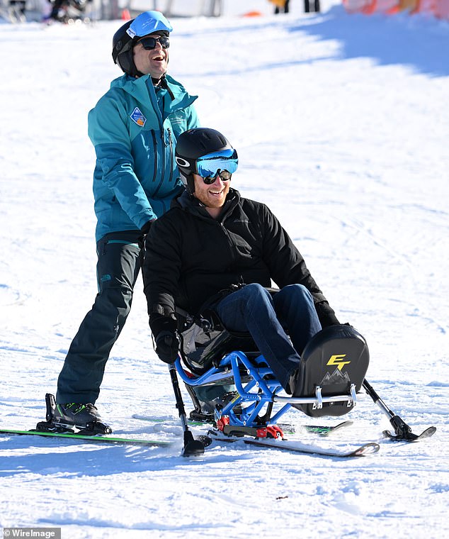 Harry tried out one of the competitors' sit-skis and appears to be having a great time as he is pushed down the slope by his instructor