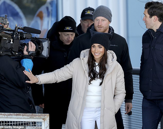 A film crew was seen joining the Sussexes as they arrived for a day of sit-skiing