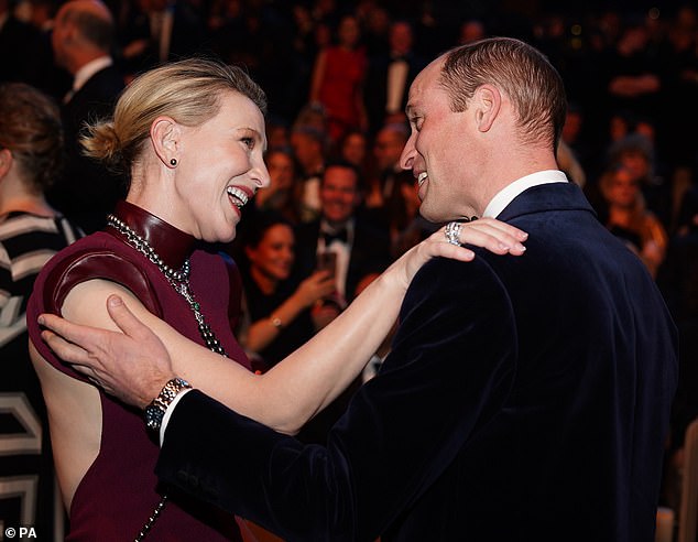 A hug for Cate: Blanchett places her arm on the Prince of Wales' shoulder as the pair greet each other