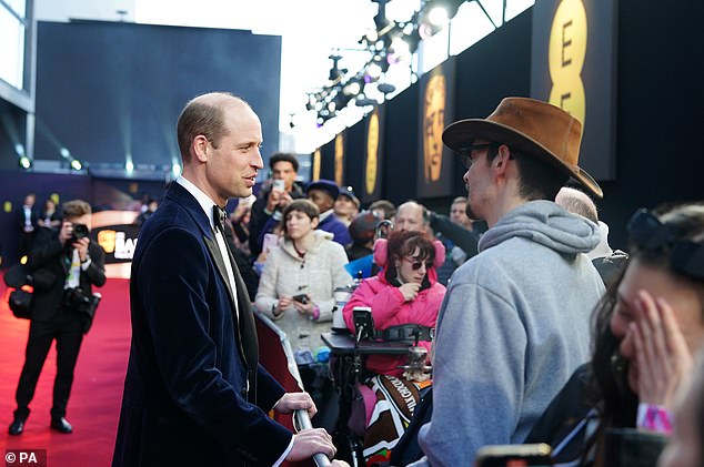 Selfies: William appeared to lean over to pose for selfies with fans as he arrived at the event