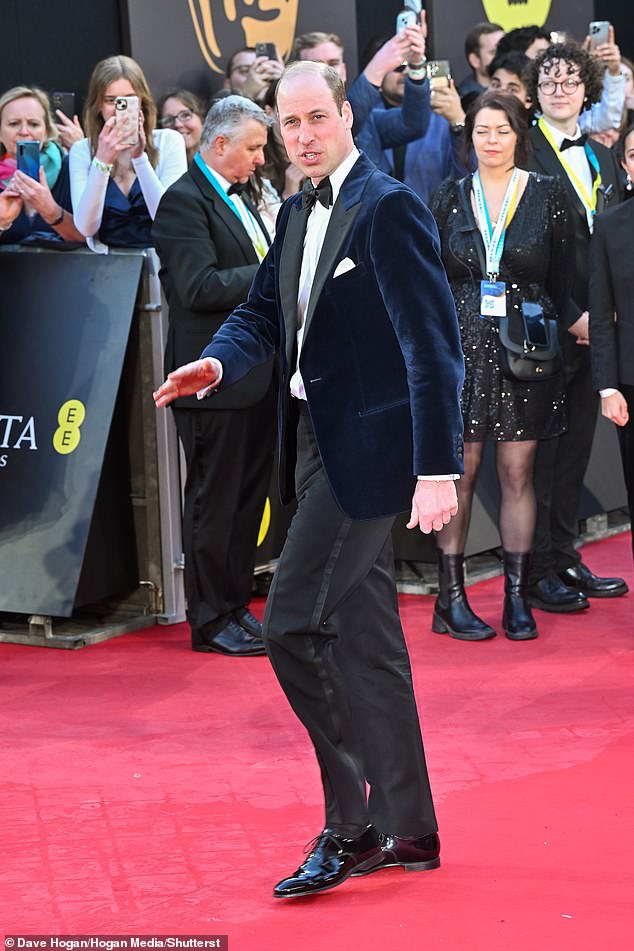 Sharp!  The prince, in a suit and boots, cut a dashing figure as he arrived for the awards ceremony