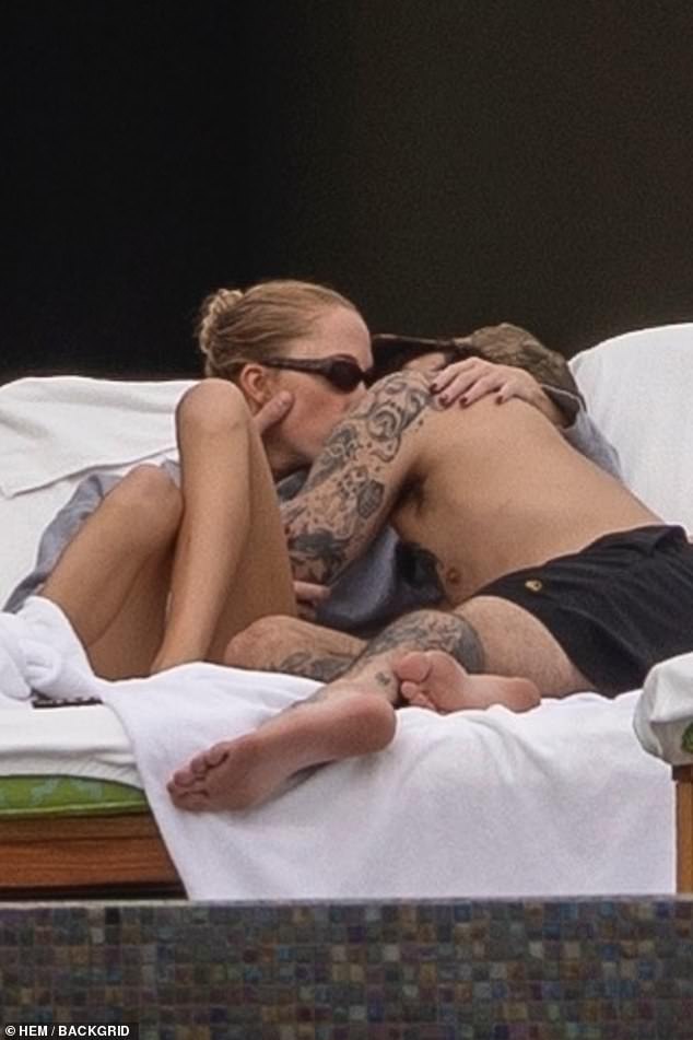 The couple was spotted sharing cuddles as they lounged in the sun together