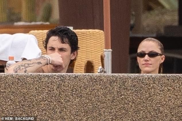 The couple appeared to be relaxing in a swimming pool