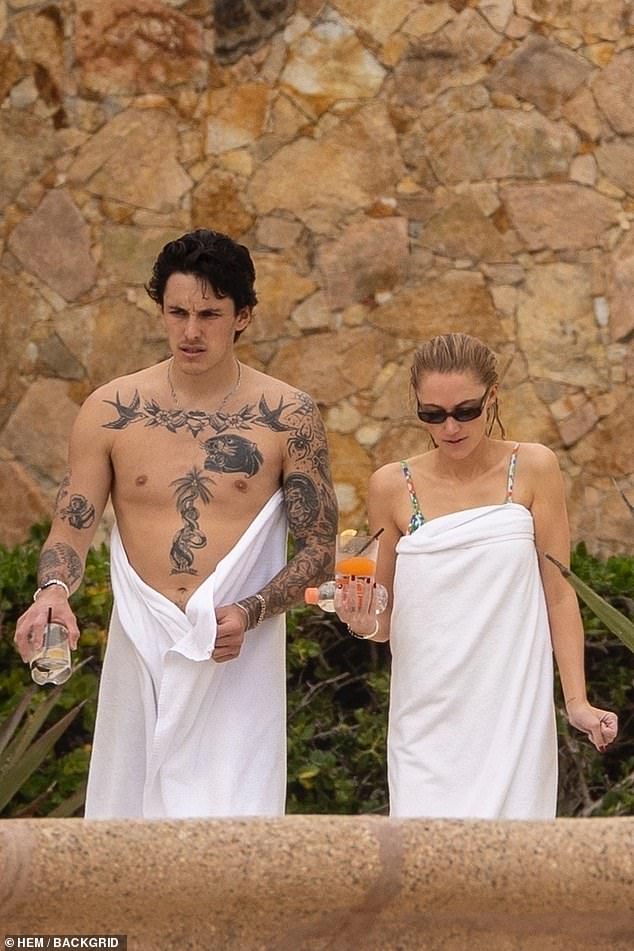 The lovebirds dried themselves off with towels