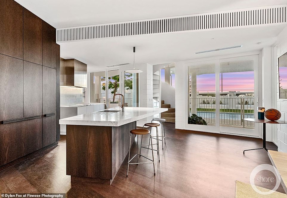 While the kitchen may look small at first glance, it is deceiving as behind it is an entire butler's pantry, complete with two ovens.  The design keeps unwanted clutter out of sight