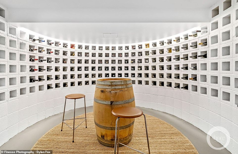 Wine lovers will love the curved cellar with room for 288 wine bottles