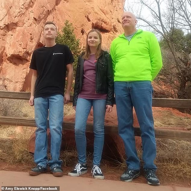 Sam, left, and his sister Ellie stand together in a family photo