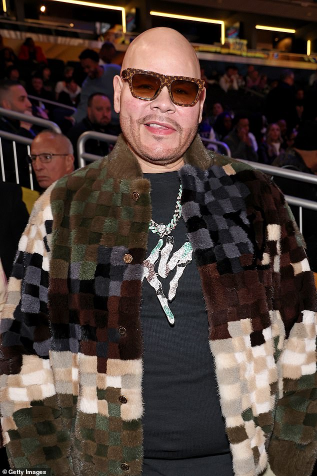 Rapper Fat Joe also attended the game wearing a plaid patterned jacket