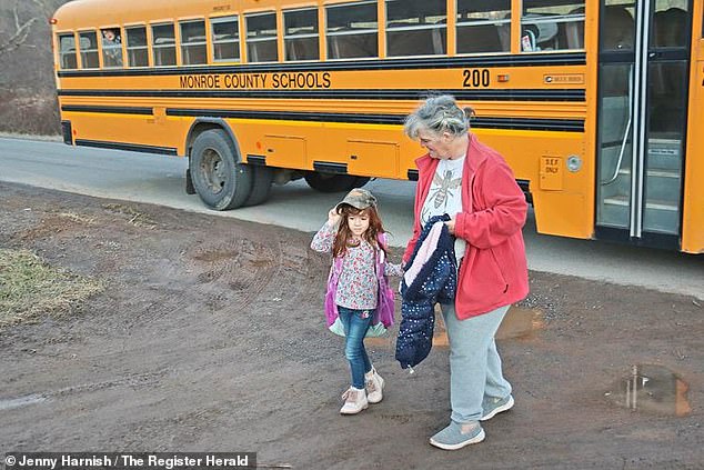 Kolbie's grandmother Tammy Hale meets her granddaughter at the bus stop.  Kolbie is the last passenger to get off the bus