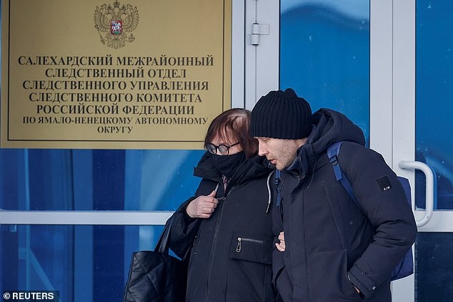 Lyudmila Navalnaya, the mother of the late Russian opposition leader Alexei Navalny, and his lawyer Alexei Tsvetkov walk out of an office of the regional branch of the Investigative Committee in the city of Salekhard