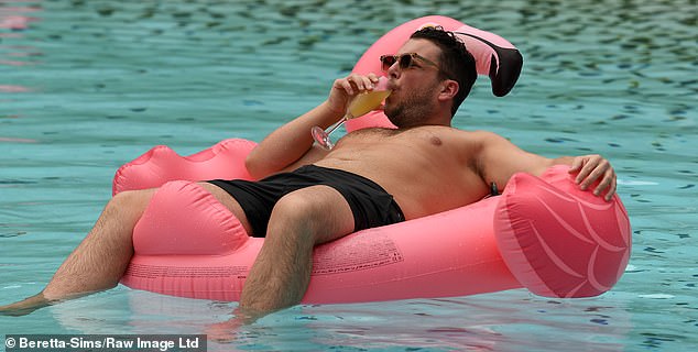 No sooner had Diags dried off than he got back in - but stayed out of trouble by floating on a pink flamingo and sipping a drink