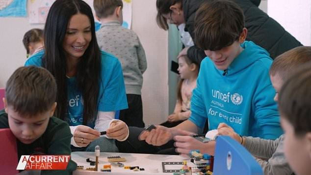 Jackson Packer and his mother Erica traveled to Moldova to work with children in refugee camps.  Image: Nine