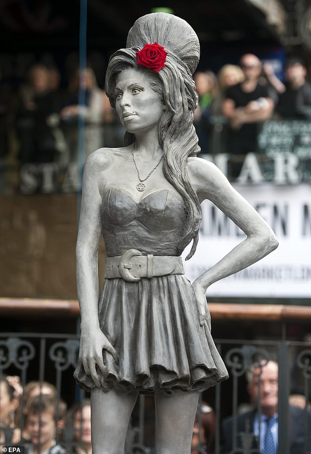 Unveiled in Camden Market in 2014, the statue stands 6 feet tall and depicts the late singer wearing the necklace.