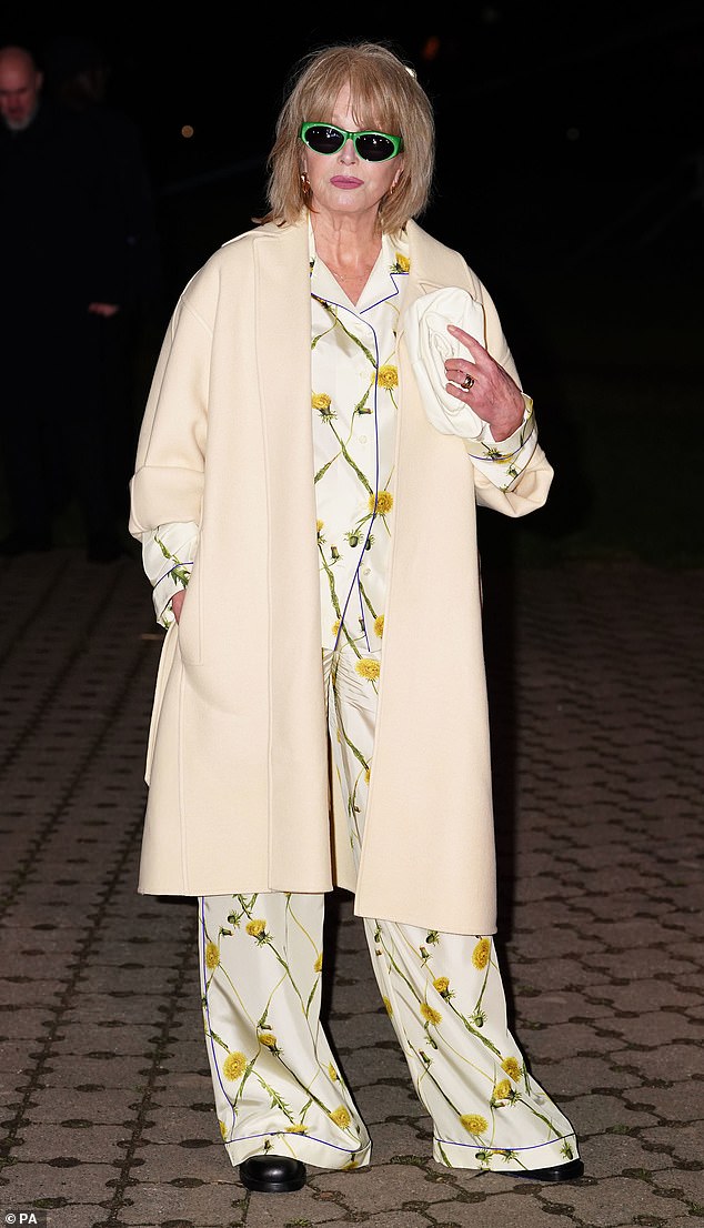 She completed the casual, yet stylish look with an oversized cream coat and accessorized with a white clutch and black leather boots.