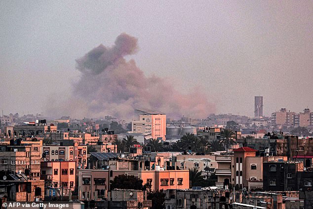 A photo taken from Rafah shows smoke wafting over Khan Yunis in the southern Gaza Strip during the Israeli bombardment on Monday