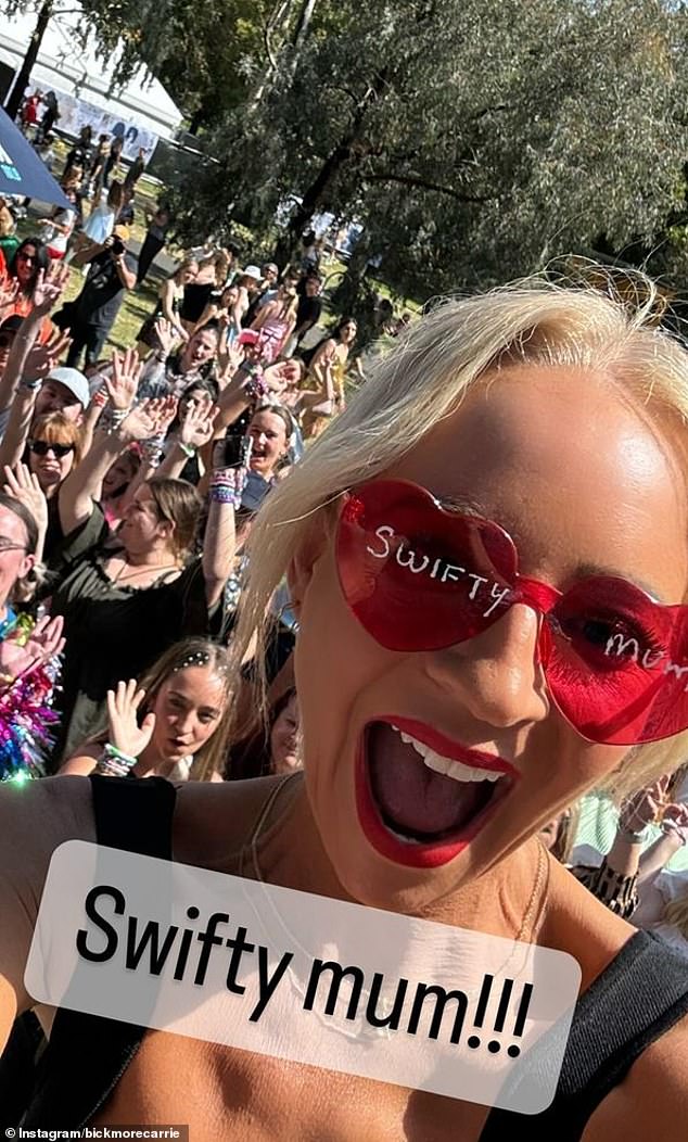 For the concert, she initially wore black sunglasses, but later swapped them for bright pink love heart glasses with 'Swiftie mum' written on them in white pen