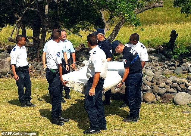 Malaysian Airlines Flight MH370 disappeared over the South China Sea during a flight from Kuala Lumpur, Malaysia, to Beijing, China, on March 8, 2014 (police are seen carrying wreckage of unidentified aircraft in the French Indian Ocean in July 2015 )