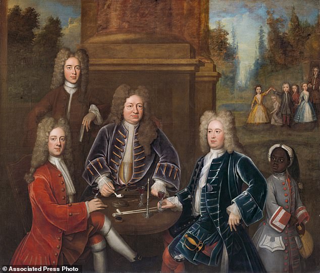 Elihu Yale and family members sit at a table with tobacco pipes and wine glasses as an enslaved boy with a metal collar around his neck looks on