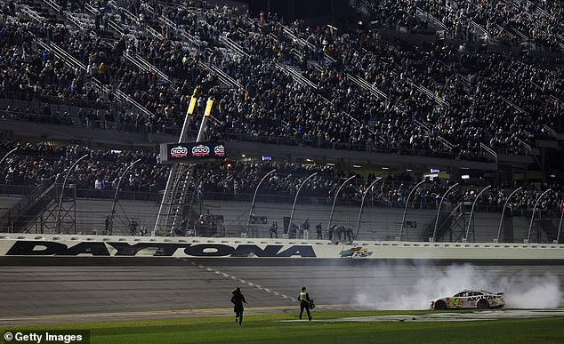 Byron, driver of the No. 24 Axalta Chevrolet, celebrates with a burnout after winning the race