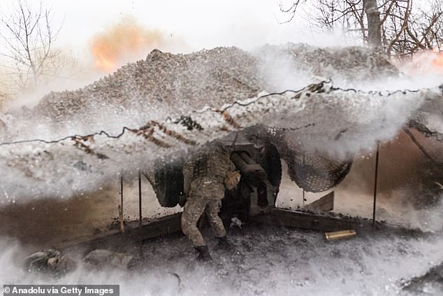 A Ukrainian soldier from the 'Tsunami' regiment fires artillery towards Bakhmut as the war between Russia and Ukraine continues in Donetsk Oblast, Ukraine on February 19, 2024