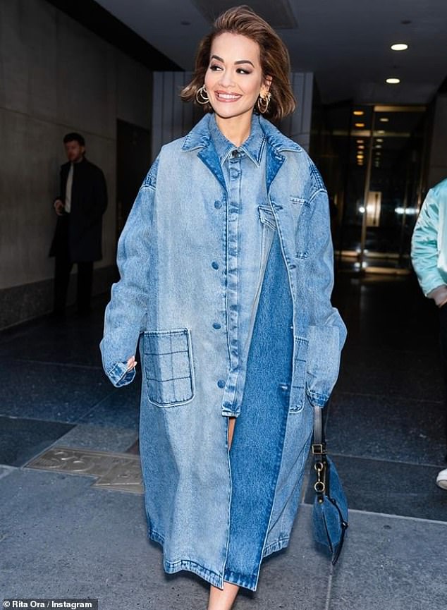 Rita also shared a stunning photo as she put her leggy on display in a thigh-skimming denim mini dress, layered under an oversized denim jacket