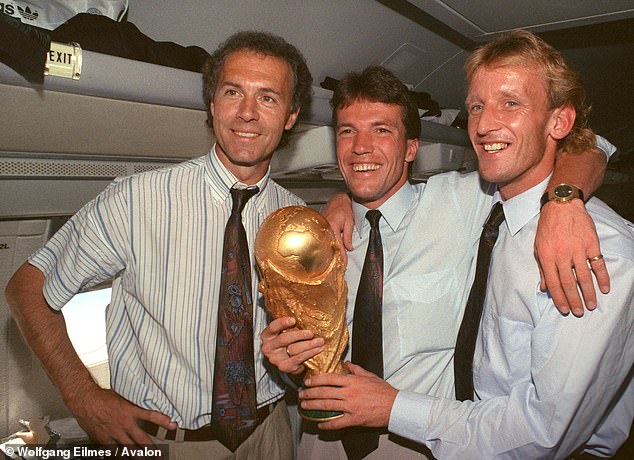 Brehme (right), pictured with Franz Beckenbauer (left) and Lothar Matthaus after the 1990 victory