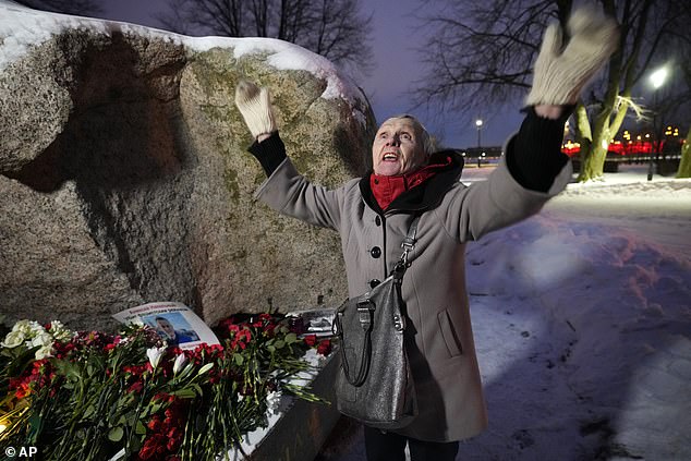 People gathered to lay flowers and paid their last respects to Alexei Navalny at the monument, a large boulder from the Solovetsky Islands, where the first camp of the Gulag political prison system was located, in Saint Petersburg