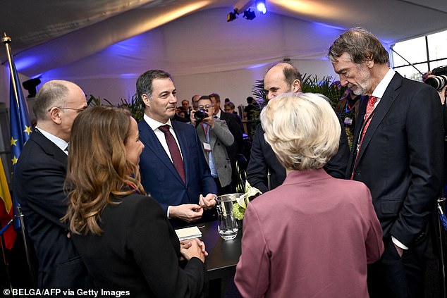 He was seen talking to Belgian Prime Minister Alexander De Croo (third from left) and European Commission President Ursula Von Der Leyen (purple shirt)