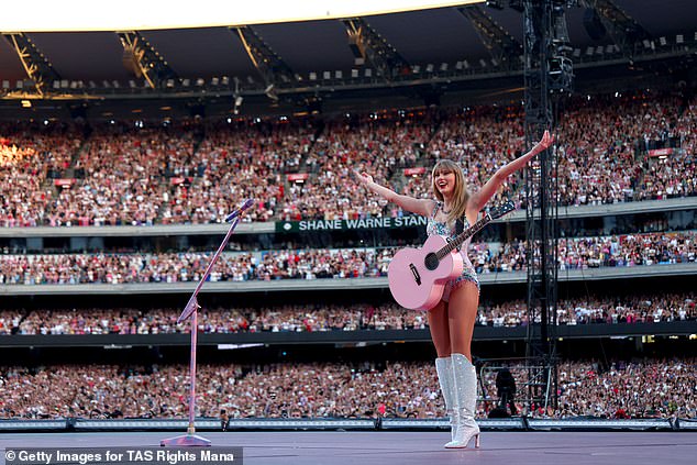 Taylor Swift is pictured on stage in Melbourne on Friday night, unaware that one of the concertgoers had just gone into labor