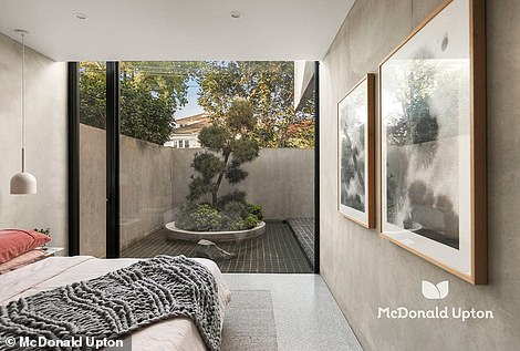 At the front of the house there is an elevated second living area, as well as a guest bedroom with its own beautiful bathroom and private courtyard