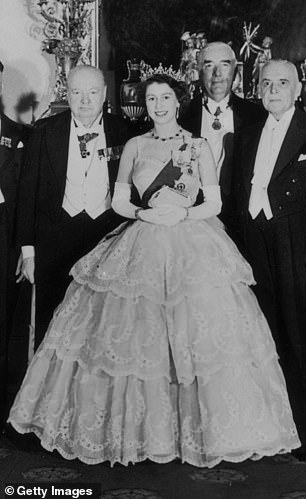 Queen Elizabeth II stands in the throne room of Buckingham Palace with seven Commonwealth Prime Ministers and two Chancellors of the Exchequer during the Economics Conference in London on December 4, 1952