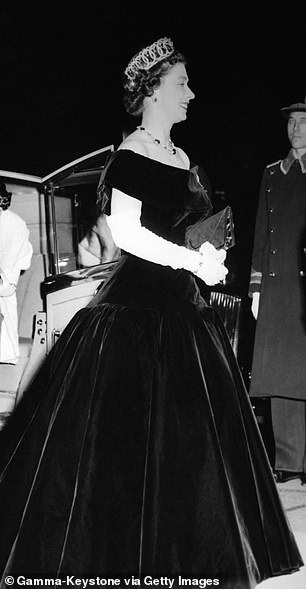 Queen Elizabeth arrives at the Royal Film Performance at the Empire Theater in London on October 29, 1956