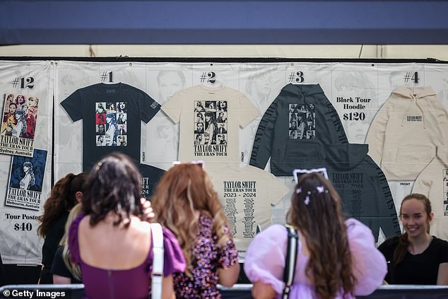 According to Nigel Bairstow, a marketing expert at the University of Technology Sydney, Swifties will spend an average of $1,300 each on their Eras Tour experience.  (Image: Fans buy Swift merchandise at MCG on February 16)