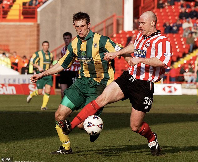 West Brom's Dobie tries to win the ball back from Sheffield United's Robert Page